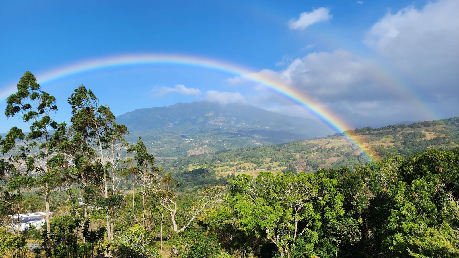 A beautiful rainbow over the mountains and valleys of Boquete, Panama